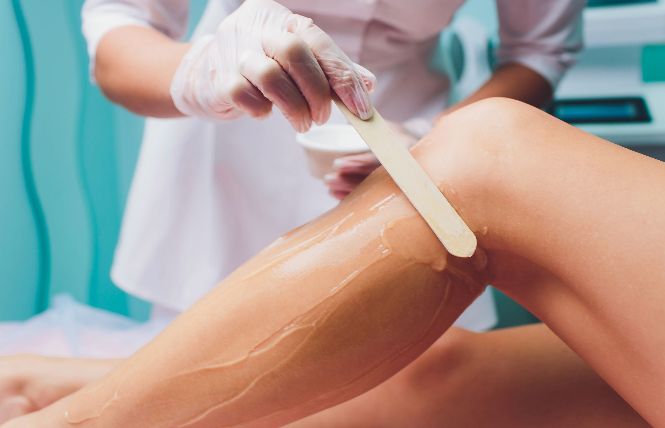 Leg waxing with hot wax